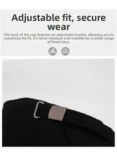 Detail view of the adjustable metal buckle on the black winter thermal baseball cap