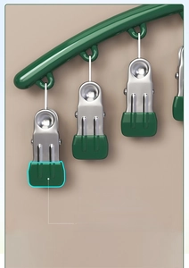 Detailed close-up of stainless steel clips with non-slip green soft rubber protective pads