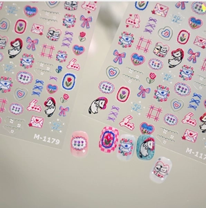 Detail of M-1179 embossed nail art stickers featuring cats, tulips and 3D glitter effects