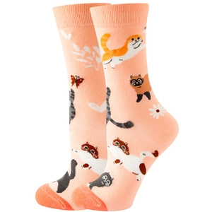 Detail of pink crew socks featuring cute cartoon cats, butterflies, and floral patterns