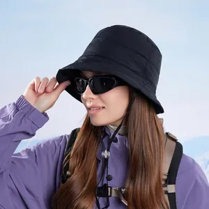 Quilted black bucket hat with adjustable windproof drawstring for outdoor winter warmth