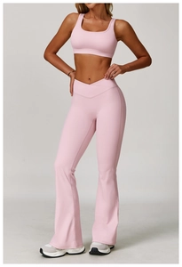 Detailed view of pink yoga set featuring U-neck sports bra and V-cross waist flared leggings