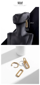 Detail view of gold hollow twist rectangular earrings with size 2.9cm by 1.0cm dimensions