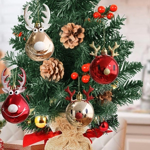 Set of four gold and red reindeer Christmas ornaments with glitter antlers on a tree