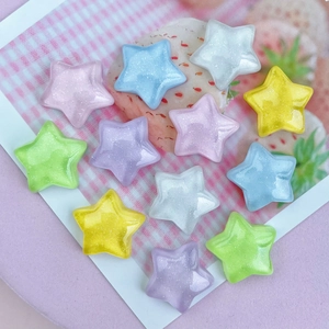 Macro shot of colorful glittery resin star charms for DIY crafts and accessories