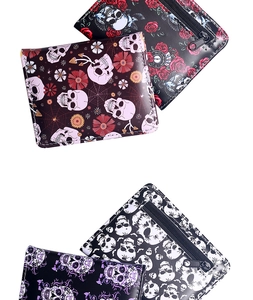 Close-up of spider skull pattern wallet with metallic zipper and gothic rose prints