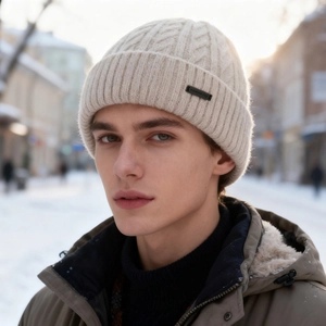 Winter beige knitted warm beanie with cable stitch texture and leather logo tag