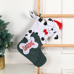Christmas stocking with dalmatian dog design and bone tag on a wooden hanging ladder