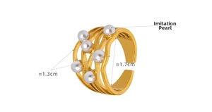 Detail view of gold wave ring with six white pearls, 1.3cm width and adjustable band