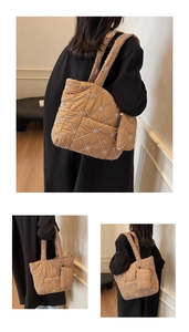 Detail of khaki quilted tote bag with embroidery pattern and matching small hanging pouch