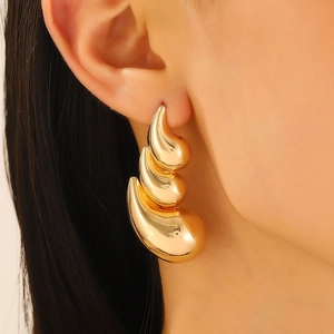 Chic gold teardrop earrings with a triple-layered petal design for a bold retro style