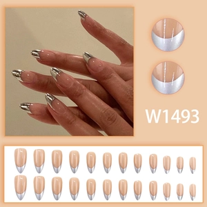 Nude pink almond fake nails with silver French tips and 24-piece press-on nail kit