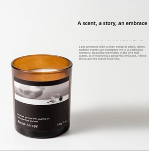 Detail of 140g soy wax scented candle in amber glass jar with minimalist black label