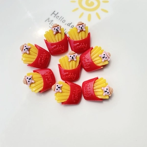 Macro view of teddy bear fries resin charms for DIY phone cases and craft projects