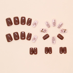 Short square press-on nails in chocolate brown and nude pink with rose floral patterns