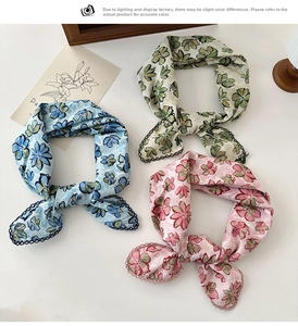 Close-up of floral cotton linen scarves with delicate lace edges in multiple colors