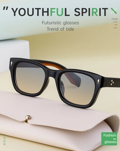 Square polarized sunglasses with black frames and gradient lenses next to a beige pouch