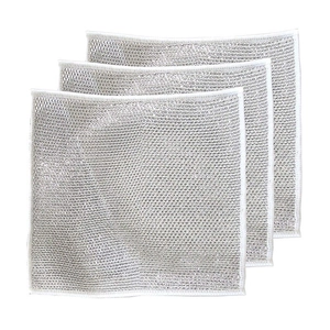 Close-up of three layered silver wire dishcloths showing mesh texture for kitchen cleaning