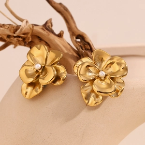 Macro shot of 18K gold plated double-layer petal earrings with a white pearl center