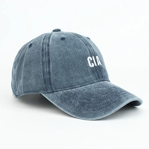 Close-up of CIA letter embroidery on navy blue washed cotton baseball cap with curved brim