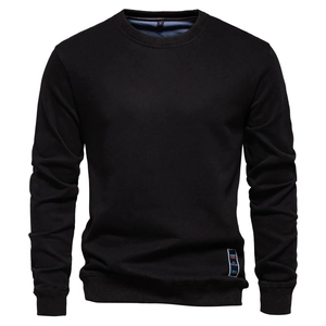 Detailed macro view of the black crewneck sweatshirt fabric texture and size S label