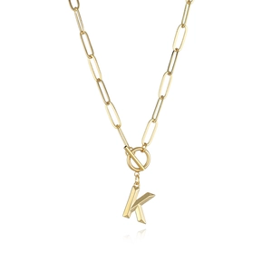 Detail of gold K initial pendant with paperclip chain and OT toggle clasp closure