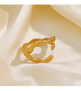 Detail shot of irregular 18K gold plated ring with wave texture on beige fabric