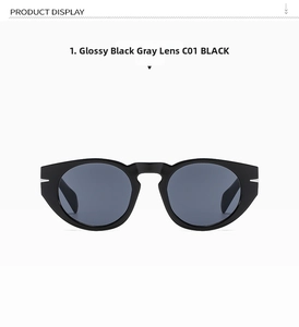Detailed view of black cat-eye sunglasses with gray lenses and silver metal hinge detail