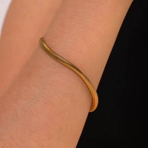 Minimalist 18k gold plated stainless steel flat snake chain bracelet worn on wrist