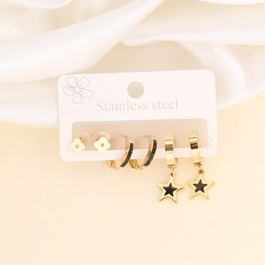 Stainless steel gold earring set featuring star charms and black enamel hoops