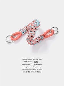 Close-up of pink and blue woven shoulder strap with silver metal rings, 60cm length