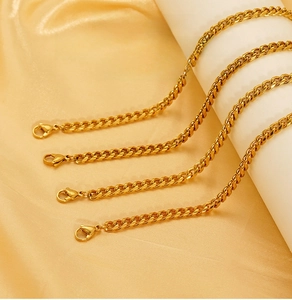 Detailed close-up of 18K gold-plated stainless steel Cuban link necklaces with lobster clasps