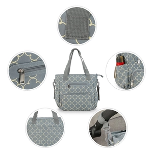 Detail showing reinforced stitching, metal zippers and stroller hooks on gray diaper bag