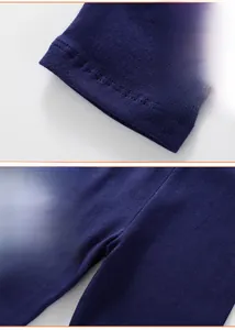 Detailed view of the precise stitching and hem design on navy blue girl leggings
