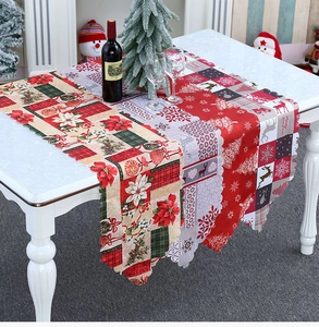 Detailed patchwork Christmas table runner with poinsettias, reindeer and festive patterns