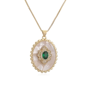 Vintage 18K gold plated necklace with oval shell pendant and green gemstone inlay
