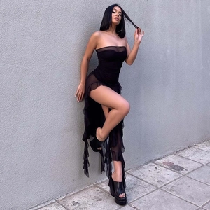 Detailed view of the ruffle mesh trim and sheer black fabric on this sexy strapless dress