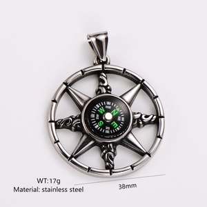 Detail view of 38mm stainless steel compass pendant with clear engraved markings