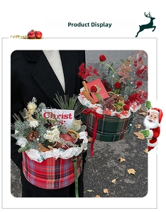 Close-up of tartan pattern Christmas gift box with pine cones and cinnamon sticks