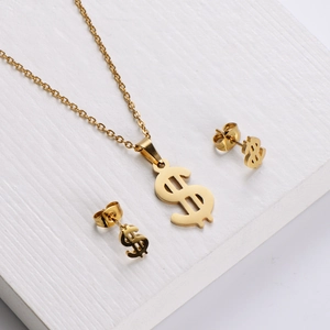 Golden dollar sign necklace and earrings set with polished finish on textured background