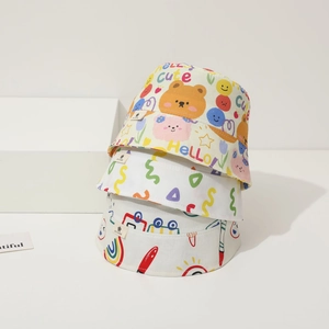 Close-up of stacked cotton baby bucket hats with colorful rainbow and bear graffiti prints