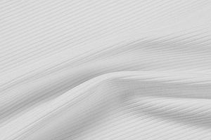 Vue macro de la texture du tissu en maille côtelée blanche et du motif vertical précis