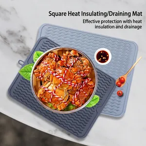 Square silicone draining mats in grey and blue with wavy texture for kitchen protection