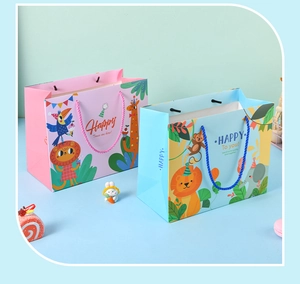 Close-up of pink and blue cartoon animal gift bags with sturdy woven handles for kids
