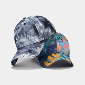 Street style baseball caps featuring tie-dye and graffiti patterns on curved brims