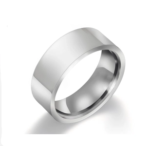 Macro view of wide minimalist silver titanium steel ring with polished mirror surface