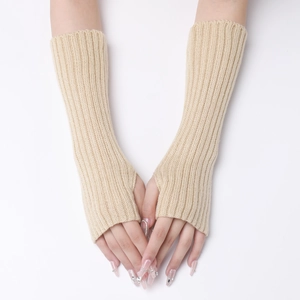 Close-up of beige ribbed knit arm warmer with functional fingerless design for warmth