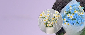 Detail of DIY chenille stem daisy bouquet with greeting card and white ribbed vase