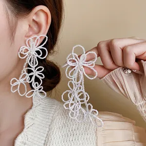 Elegant white seed bead flower tassel earrings with long fringe in French retro style
