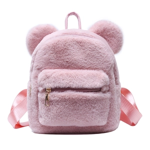 Pink plush bear-shaped backpack for girls with fuzzy texture and cute round ears